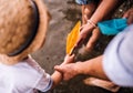 A midsection of family with two toddler child outdoors by the river in summer. Royalty Free Stock Photo