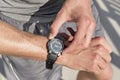 Midsection of fit man checking time on path in park Royalty Free Stock Photo