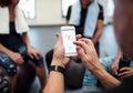 A midsection of group of seniors with smartphone in gym checking heart rate. Royalty Free Stock Photo