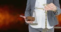 Midsection of judge holding law scales and hammer Royalty Free Stock Photo