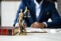 Midsection Of Judge Reading Documents At Desk Royalty Free Stock Photo