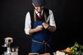 Midsection of male chef sharpening knife in commercial kitchen Royalty Free Stock Photo