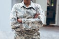 Midsection of mid adult female african american soldier in uniform standing with arms crossed Royalty Free Stock Photo