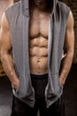 Midsection of muscular man wearing hood