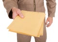 Midsection Of Postman Holding Envelopes