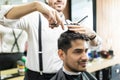 Professional Barber Giving Haircut To Male In Shop Royalty Free Stock Photo