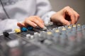 Midsection Of Radio Host`s Hands Using Music Mixer In Studio Royalty Free Stock Photo