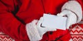 Composite image of midsection of santa claus holding blank placard Royalty Free Stock Photo