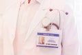 Midsection of senior doctor with identity card and stethoscope at hospital Royalty Free Stock Photo