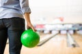 Boy Practicing Bowling With Green Ball In Club Royalty Free Stock Photo