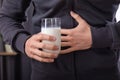 Man Having Stomach Pain Holding Glass Of Milk