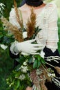 Woman holding bunch of wildflowers Royalty Free Stock Photo