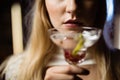 Midsection of woman holding martini glass Royalty Free Stock Photo