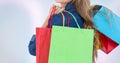 Midsection of woman holding shopping bags against white background Royalty Free Stock Photo