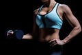 Midsection of woman lifting dumbbell Royalty Free Stock Photo