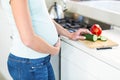 Midsection of woman with vegetables on board Royalty Free Stock Photo
