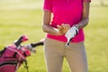Midsection of woman wearing golf glove Royalty Free Stock Photo
