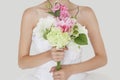 Midsection of young bride holding fresh bouquet Royalty Free Stock Photo