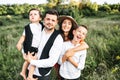 Midshot of a happy family outside on nature Royalty Free Stock Photo