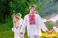 Midsummer. A group of young people of Slavic appearance at the celebration of Midsummer