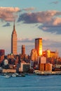 Midtown West Manhattan at sunset with the Empire State Building, One Penn Plaza and the New Yorker Hotel. New York City