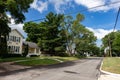 Midwest Neighborhood Street with Old Homes and Green Trees during the Summer in Lemont Illinois