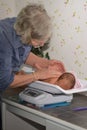 Midwife with baby Royalty Free Stock Photo