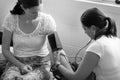 Midwife checks pregnant woman blood pressure Royalty Free Stock Photo