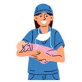 A midwife or a doctor with a newborn. A woman nurse, doctor or midwife smiles in a blue uniform, standing holding a