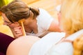 Midwife seeing mother for pregnancy examination Royalty Free Stock Photo