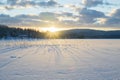 Midwinter pale sun barely over the mountains