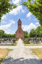 Church with cemetery surrounded by big trees