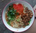 Mie Ayam,chicken noodles with sambal and hot sauce Royalty Free Stock Photo