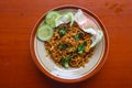 mie tek tek or fried noodle made with egg noodles with chicken, cabbage, mustard greens, meatballs, scrambled eggs. indonesian. Royalty Free Stock Photo