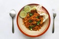 mie tek tek or fried noodle made with egg noodles with chicken, cabbage, mustard greens, meatballs, scrambled eggs. indonesian. Royalty Free Stock Photo