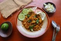 mie tek tek or fried noodle made with egg noodles with chicken, cabbage, mustard greens, meatballs, scrambled eggs. indonesian. Royalty Free Stock Photo