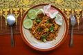 mie tek tek or fried noodle made with egg noodles with chicken, cabbage, mustard greens, meatballs, scrambled eggs. indonesian. Royalty Free Stock Photo