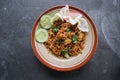 mie tek tek or fried noodle made with egg noodles with chicken, cabbage, mustard greens, meatballs, scrambled eggs. indonesian. Royalty Free Stock Photo