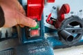 Carpenter starting the Bosch Gts 10 XC table saw.