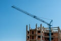 New apartment building with crane at local construction site.