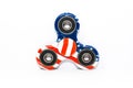 United States flag design on fidget spinner game on white background.