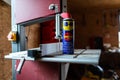 WD-40 multi use product on band saw table in a small woodworking shop.