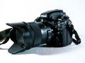 Nikon D800 Dslr photography camera with Sigma 35 mm lens on white background.