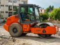 Hamm road roller on street construction site.