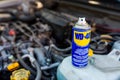 WD-40 multi purpose penetrating oil on old japanese car engine, space for text. Royalty Free Stock Photo