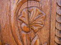 Detailed hand carved flower on traditional hungarian oak wood gate pylon . Royalty Free Stock Photo