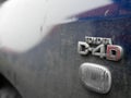 D4D Toyota engine sign on dirty used car.