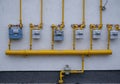 Natural gas consumption meters in row on residential house . Royalty Free Stock Photo