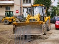 Parking  JCB and Volvo excavators in the small town. Royalty Free Stock Photo