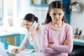 Resentful little girl and her mom working Royalty Free Stock Photo